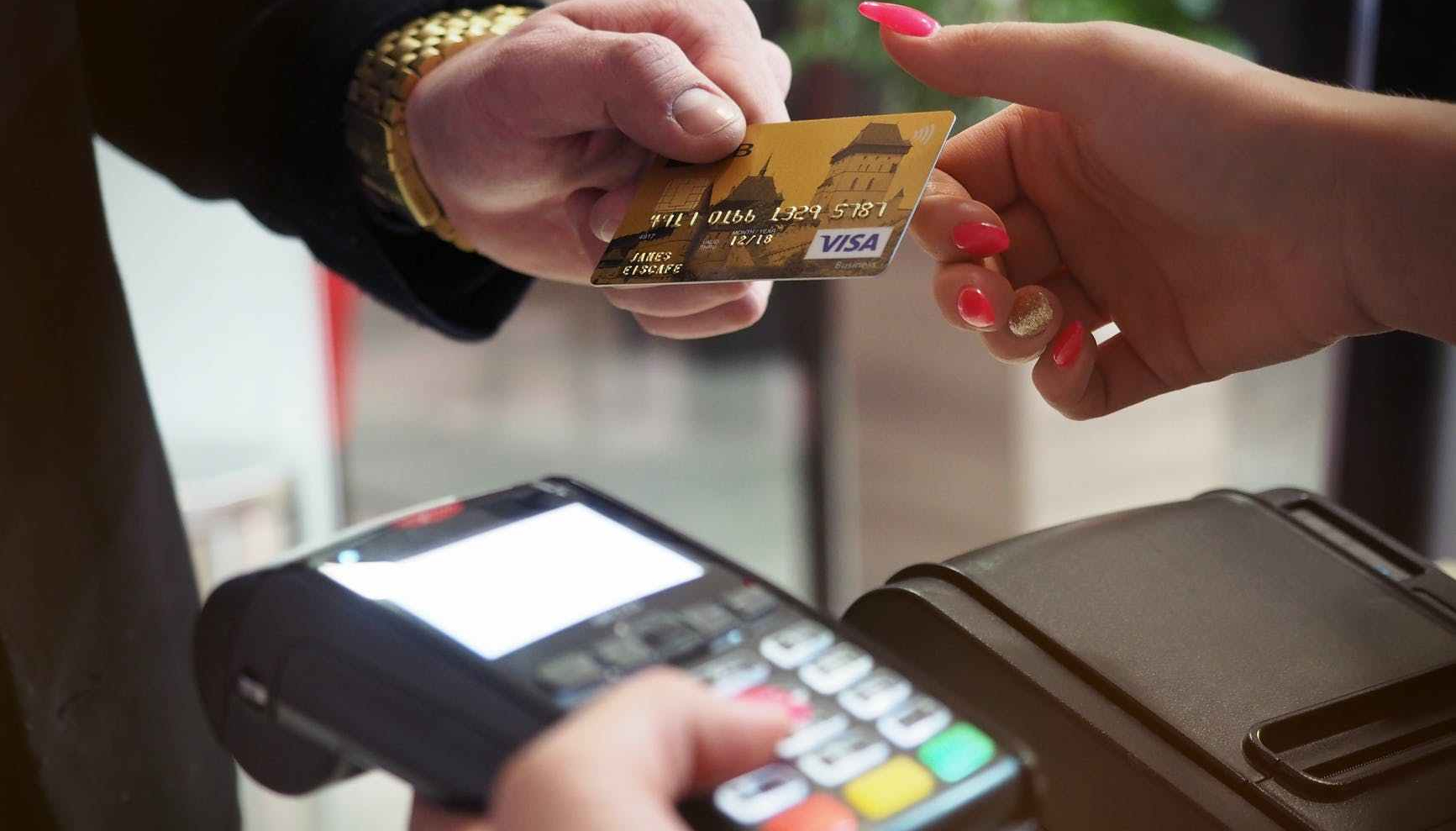 photo of person handing card